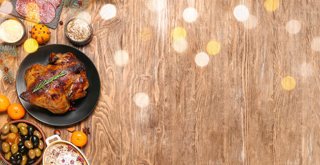 Different tasty dishes for Christmas dinner on wooden background with space for text
