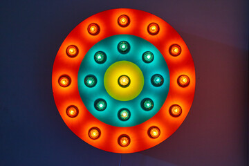 Circle red, blue, and yellow neon light on wall