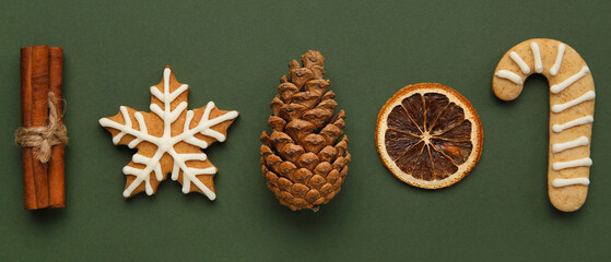 Beautiful Christmas composition with cookies and decor on green background