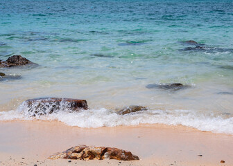 Landscape summer front view  tropical sea beach rock blue white sand background calm Nature ocean...
