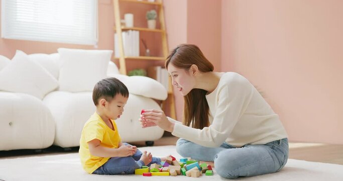 Asian Family Playing With Building Blocks