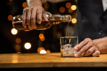 Barman pouring whiskey whiskey glass ..