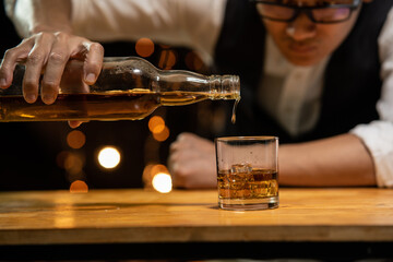 Barman pouring whiskey whiskey glass beautiful night