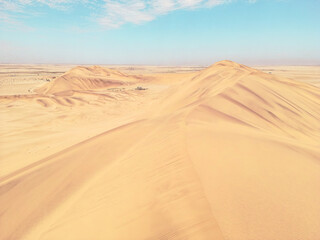 Fototapeta na wymiar Namibia Desert. Aerial View Sand Dunes near Walvis Bay and Swakopmund. Skeleton Coast. Namibia. Africa.