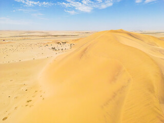 Fototapeta na wymiar Namibia Desert. Aerial View Sand Dunes near Walvis Bay and Swakopmund. Skeleton Coast. Namibia. Africa.