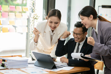 Group of asian business people working, discussing new projects together, having fun at the office.