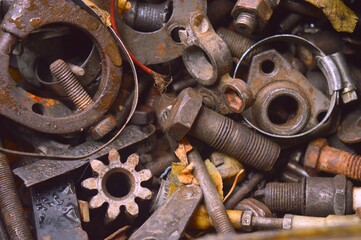 Old spare parts nuts and bolts scrap metal mixed 