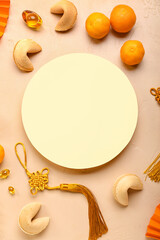 Blank card with fortune cookies, mandarins and Chinese symbols on beige background. New Year celebration