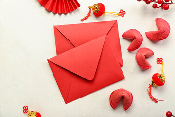Red envelopes with fortune cookies and Chinese symbols on white background. New Year celebration