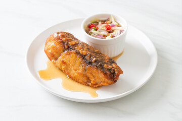 fried snapper fish with fish sauce and spicy salad