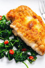 roasted duck breast served with salad of spinach leaves and chilli pepper