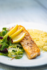 salmon fillet with couscous and vegetables salad