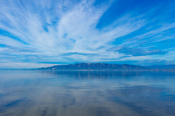 Delta del Ebro,  Catalonia in Spain- calm lake with clouds reflected in perspective