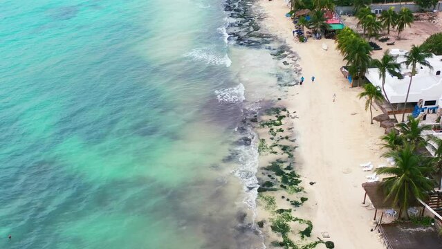 tropical white sand rocky beach coastline in Playa Del Carmen Mexico, aerial