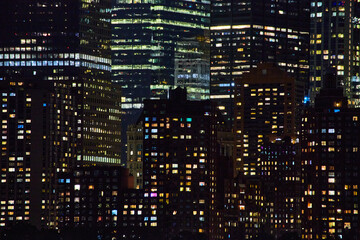 Fototapeta na wymiar City lights skyscraper detail at night of building lights in New York City