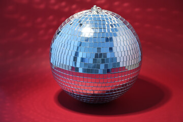 Disco ball on red background