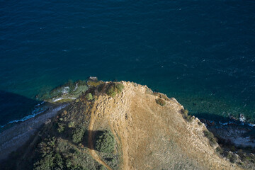 Punta Sasso, top view. High rock in the water, Punta Sasso. Top view cliffs on Lake Garda.
