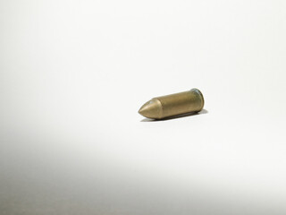 a Bullet isolated on white, the Bronze pistol bullet isolated on white
