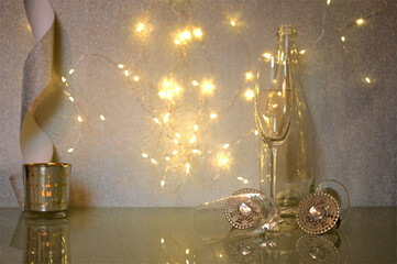 Christmas and New Year holiday background with a champagne glass and bokeh lights background