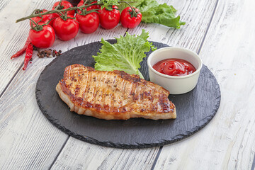 Grilled pork steak with ketchup