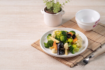 Homemade fresh boiled vegetables with cauliflower, broccoli, black fungus and baby corn.