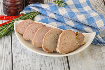 Baked pork tenderloin served rosemary