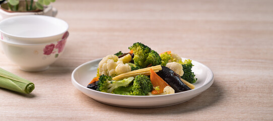 Homemade fresh boiled vegetables with cauliflower, broccoli, black fungus and baby corn.