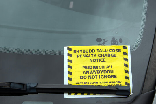 Welsh parking ticket on windscreen of car