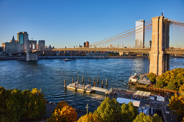 Fototapeta na wymiar Stunning Brooklyn Bridge New York City with view of river and skyline