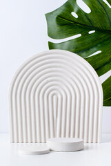 A minimalistic scene of white gypsum podium on white background, for natural cosmetics - obrazy, fototapety, plakaty