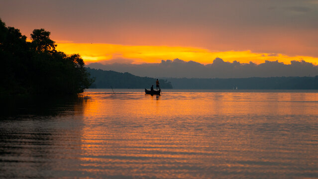 Fisherman in Munroe Island at sunrise , Ashtamudi Lake, Kerala Backwaters