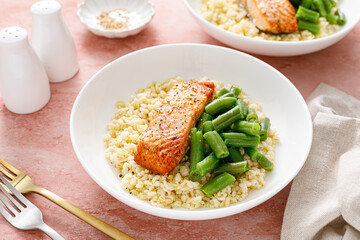 Salmon fillet grilled with bulgur and green beans. Healthy food, diet