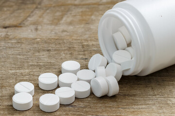 Oral medicine, paracetamol on wooden table.Oral medicine, paracetamol,white pills.