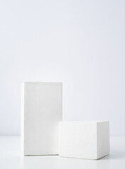 A minimalistic scene of a gypsum podium on white background, for natural cosmetics