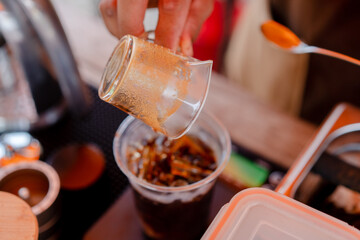 pour coffee in ice glass
