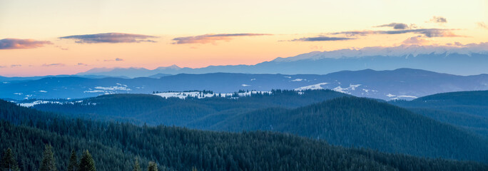 Beautiful landscape with snowy mountain slopes of the Rhodopes, Bulgaria at sunset.