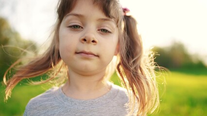 people in the park. portrait little girl outdoors. happy family kid dream concept. child a girl kid sun portrait close-up in sun the park glare. happy cute baby in summer outdoors close up portrait