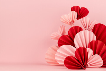 Tender Valentines day stage with levitate as flow mix red and pink paper hearts on soft pink color,...