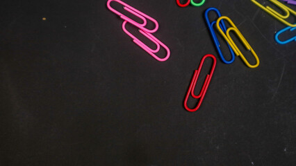 Paper clip isolated on a black background