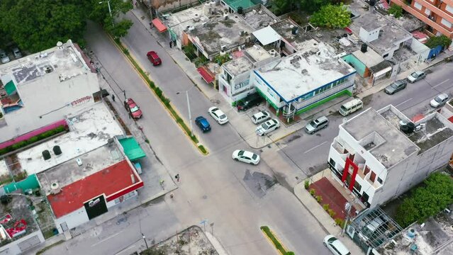 overhead aerial of cars driving on streets of Playa Del Carmen in Mexico on a sunny day