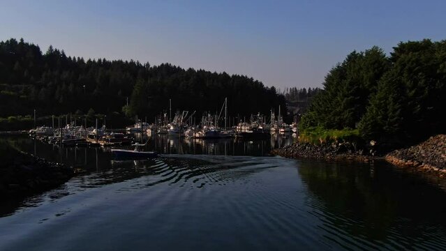 Mooring Sailboats And Yachts In The Marina With Peaceful Water During Sunset In Juneau Town Alaska. Aerial Drone Shot