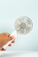 small portable fan with white background