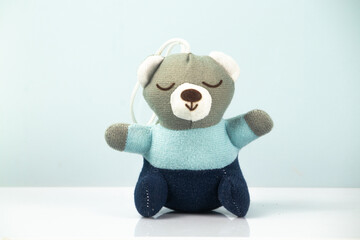 little teddy bear sleeping on white background