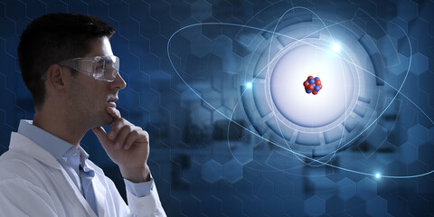 Young scientist analysing holographic atomic structure: glowing electrons orbiting around nucleus....
