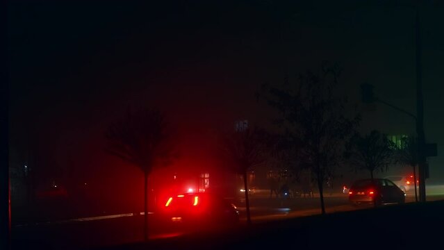 Russian aggression in Ukraine resulting in electricity outage in the cities and long blackouts. Transport and people moving by the streets in darkness.