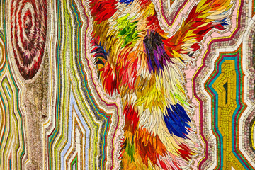 Vibrant colorful mosaic art on wall from angle in New York City subway