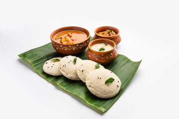 Idly sambar or Idli with Sambhar and green, red chutney. Popular South indian breakfast