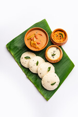 Idly sambar or Idli with Sambhar and green, red chutney. Popular South indian breakfast