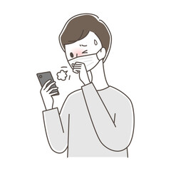 苦しそうに咳をしながらスマートフォンを見るマスクの男性