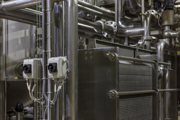 Closeup view of equipment in a milk factory.